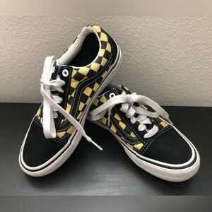 Black and yellow checkered Vans